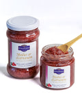 two jars Honey with cranberries - cranberry honey