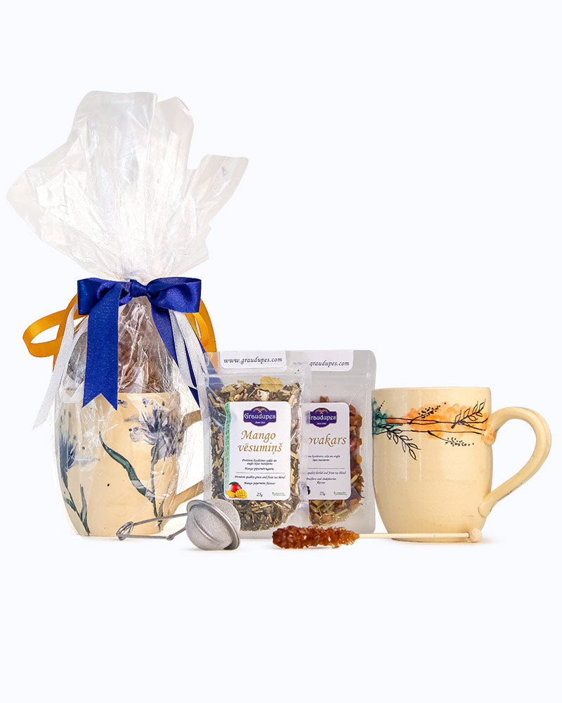 Tea Gift Set with Mug" includes two 25g tea packets of the buyer's choice, a handcrafted mug, a tea mesh strainer, and a sugar crystal stick Package