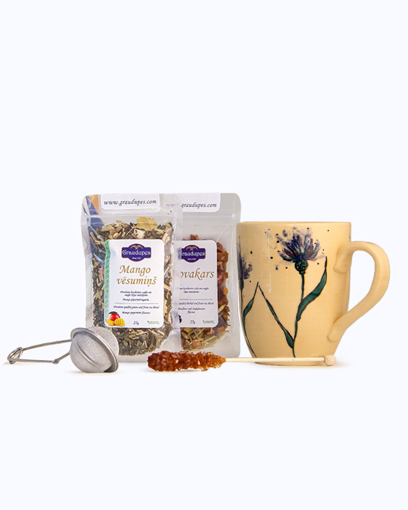 Tea Gift Set with Mug" includes two 25g tea packets of the buyer's choice, a handcrafted mug, a tea mesh strainer, and a sugar crystal stick Package