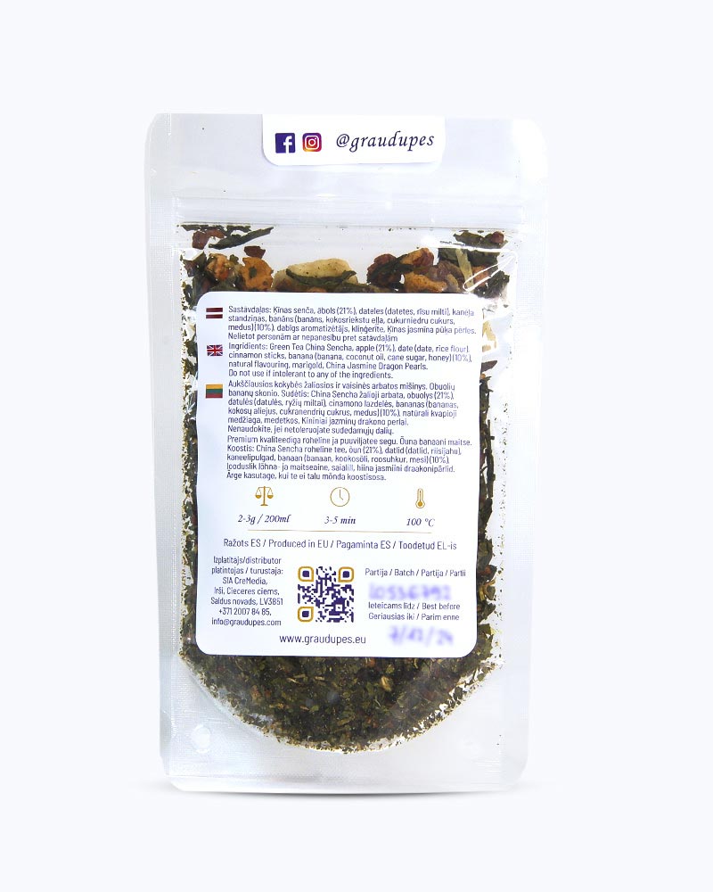 Packed tea in transparent doypack, back side. Banana Pudding, Graudupes Whole Leaf Green Tea Blend, Sencha Loose Leaf Tea with dried Apple and Banana Pieces.