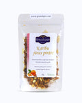 Packed tea in transparent doypack, front side. Pirates of the Caribbean, Graudupes Tropical Fruit Tea Blend, Tropical fruits, Loose leaf tea with tropical fruit pieces, Caramel & Tangerine Taste.