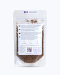 Packed tea in transparent doypack, back side. Rooibo Colada, Graudupes Rooibos and Honeybush Tea Blend, Piña Colada Rooibos Mix, Loose leaf tea with coconut pieces and dried pineapple.
