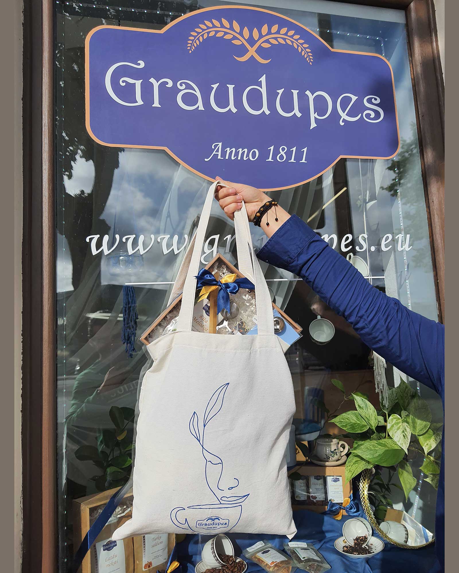 Natural Cotton Tote Bag [40cm X 35cm], female hand holding Eco-friendly Canvas Shopping Bag full of items and gifts from Graudupes shop.