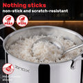 A stainless steel Zinox Clad pot filled with white rice on a dark kitchen background, with promotional text reading 'Nothing sticks non-stick and scratch-resistant' and icons for no PFAS and no PTFE. ANother icon saying 