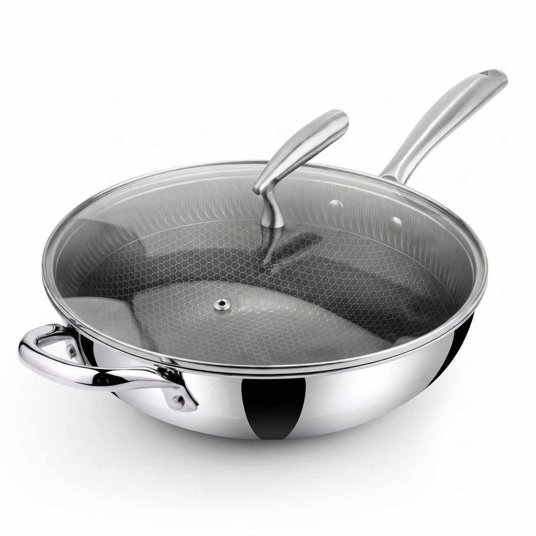 A stainless steel Zinox Clad wok with a weighted glass lid that has a steam vent and an ergonomic stainless steel handle, the wok has a honeycomb textured non-stick ceramic interior and two polished stainless steel handles one long handle and one helper handle on the other side, both handles are riveted to the wok's body. the product is shown on a clean white background.