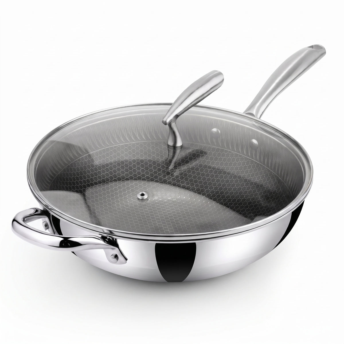 A stainless steel Zinox Clad wok with a weighted glass lid that has a steam vent and an ergonomic stainless steel handle, the wok has a honeycomb textured non-stick ceramic interior and two polished stainless steel handles one long handle and one helper handle on the other side, both handles are riveted to the wok's body. the product is shown on a clean white background.