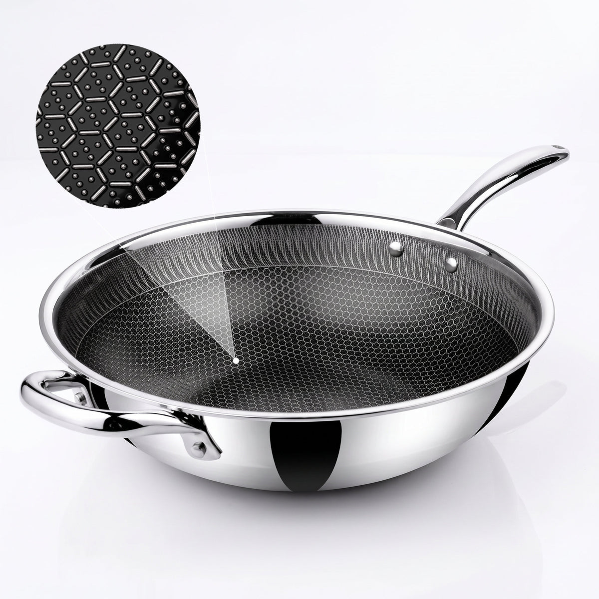A Zinox Clad stainless steel wok with a black textured non-stick ceramic interior, shown on a clean white background with a circular inset detail of the interior honeycomb pattern.