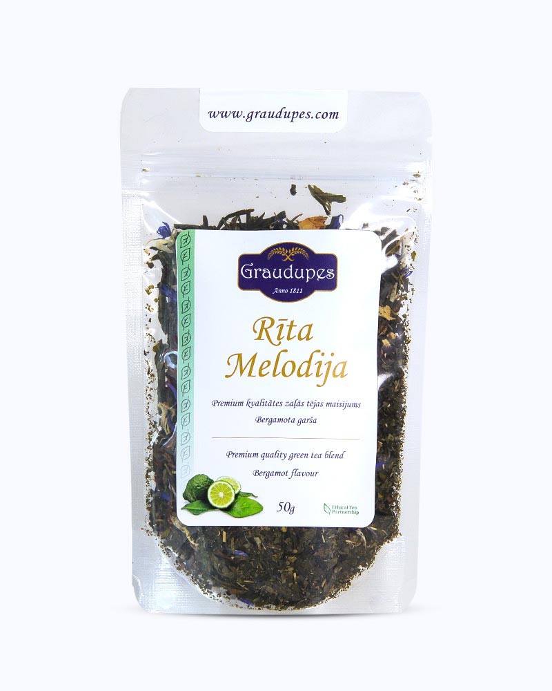 Packed tea in transparent doypack, front side. Morning Melody, Graudupes Whole Leaf Green Tea Blend, Sencha loose leaf tea with rose petals, Mango and Bergamot Taste.