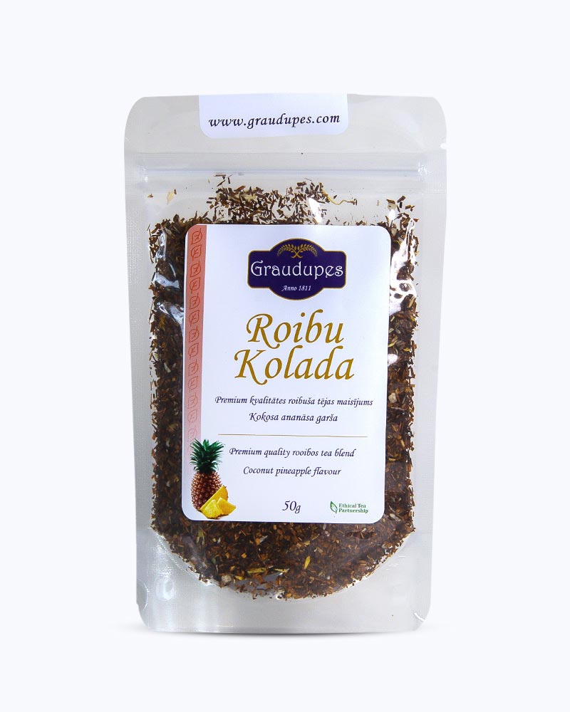 Packed tea in transparent doypack, front side. Rooibo Colada, Graudupes Rooibos and Honeybush Tea Blend, Piña Colada Rooibos Mix, Loose leaf tea with coconut pieces and dried pineapple.